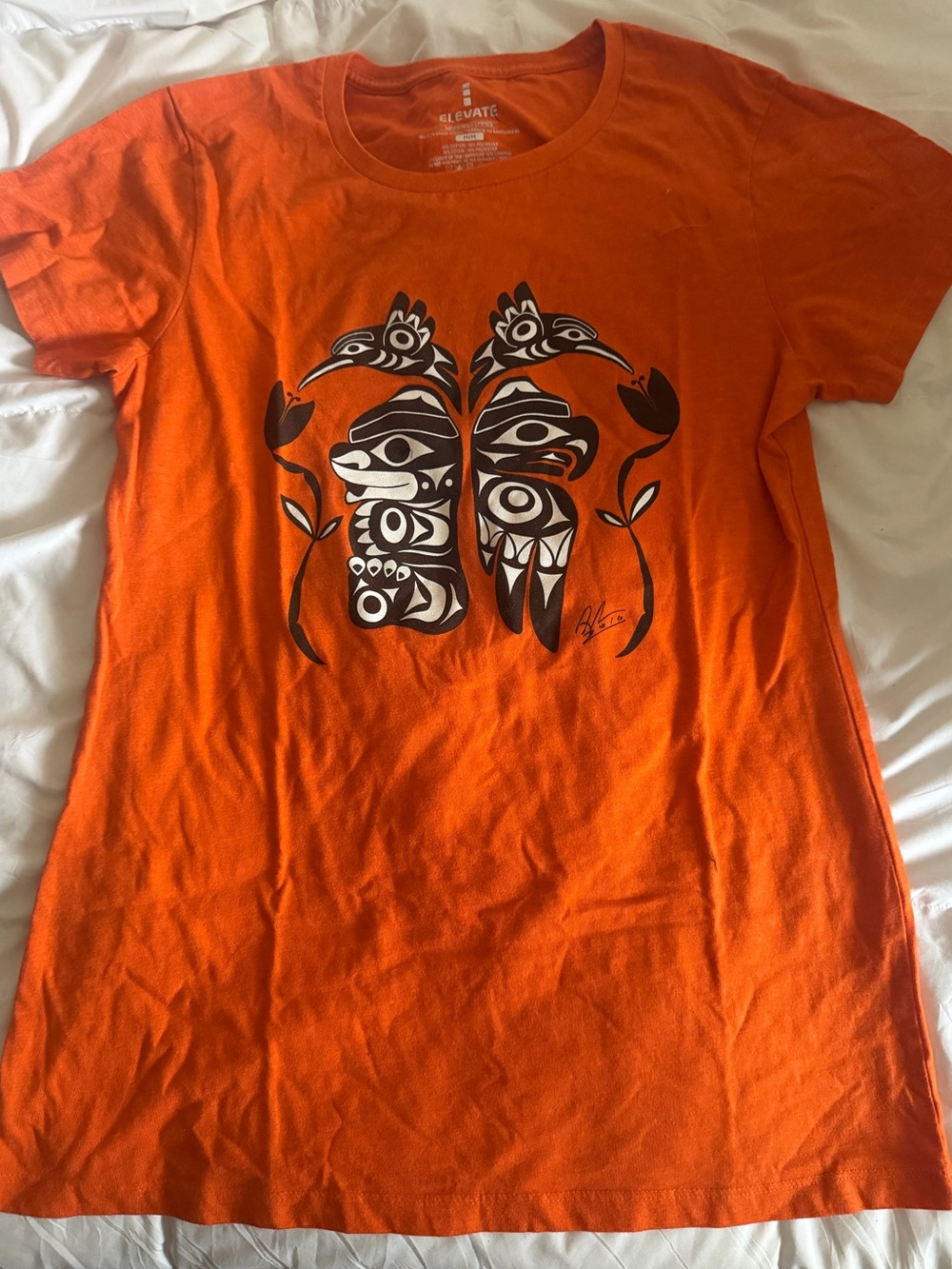 🪶 Elevate Orange Graphic Tee with Tribal Print “Every Child Matters”